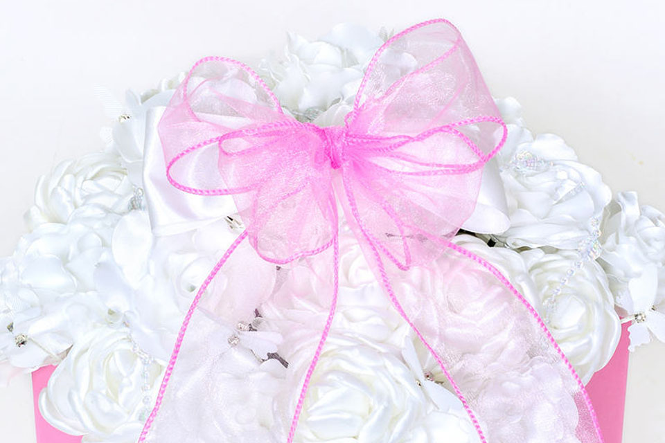 Wired ribbon decorating a wedding ceremony aisle