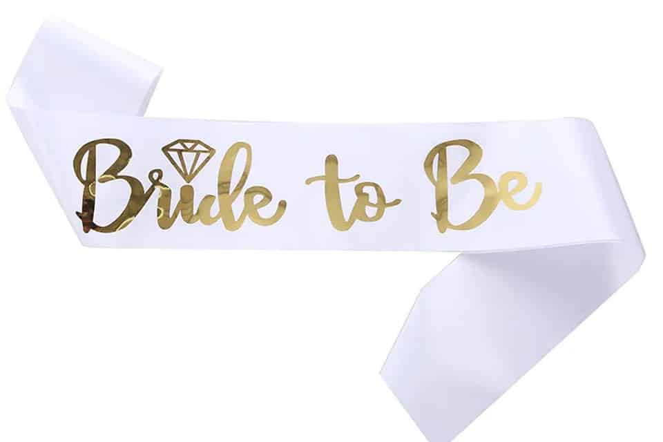 Ribbon sashes worn by a wedding party